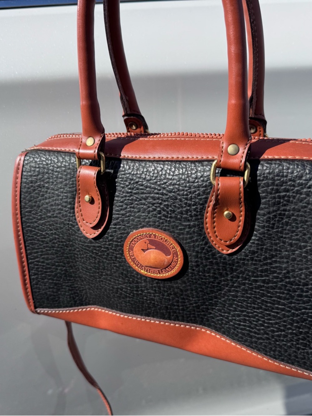 NWOT probably fake Dooney & Bourke Black and Brown Leather Satchel